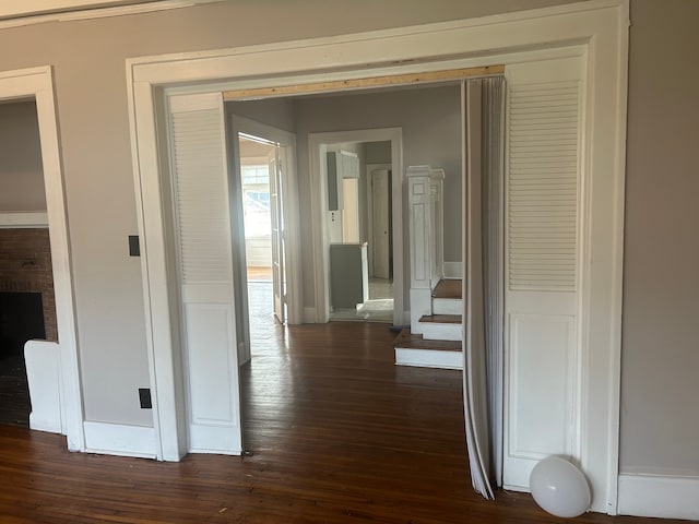 hall with dark hardwood / wood-style flooring