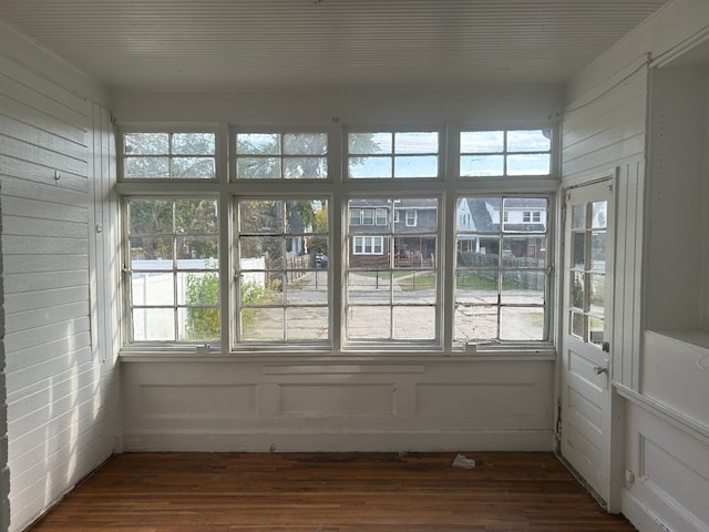 unfurnished sunroom featuring plenty of natural light