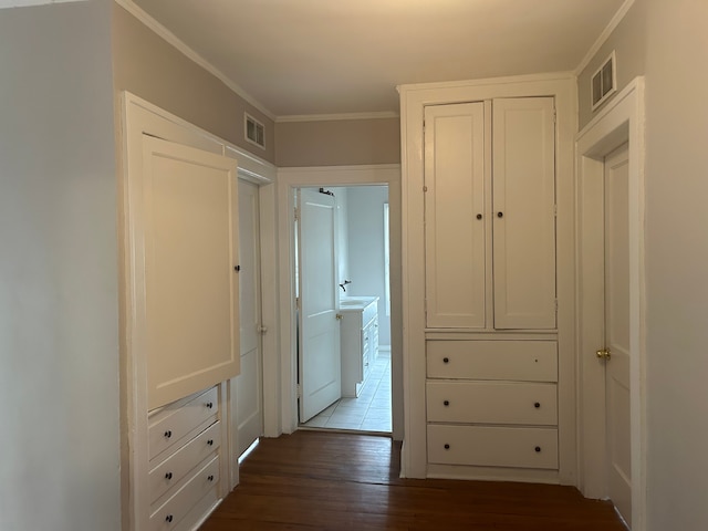 hall with crown molding and wood-type flooring