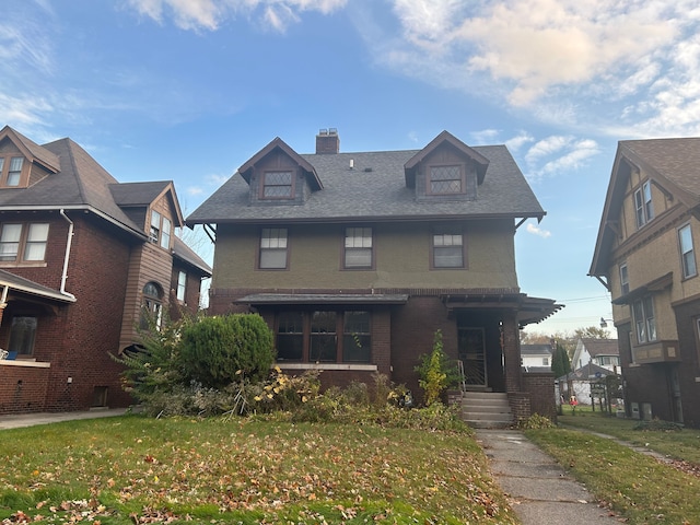 front facade with a front yard