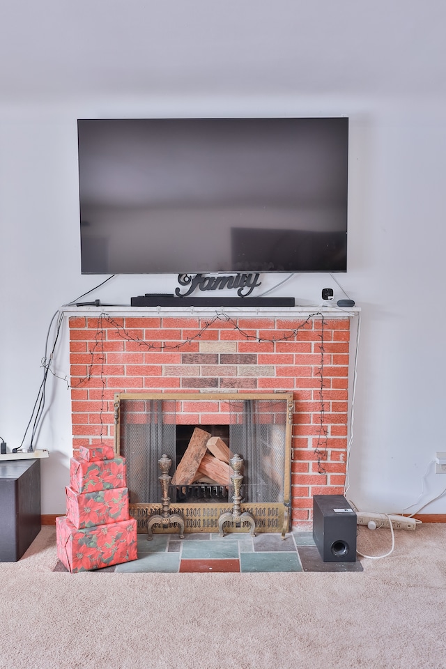 interior details featuring a fireplace and carpet flooring