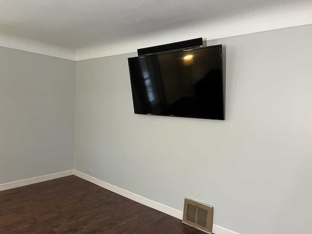 spare room featuring dark hardwood / wood-style floors