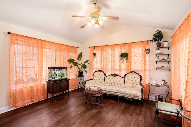 sitting room featuring vaulted ceiling, ceiling fan, and dark wood-type flooring