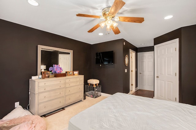 carpeted bedroom featuring ceiling fan