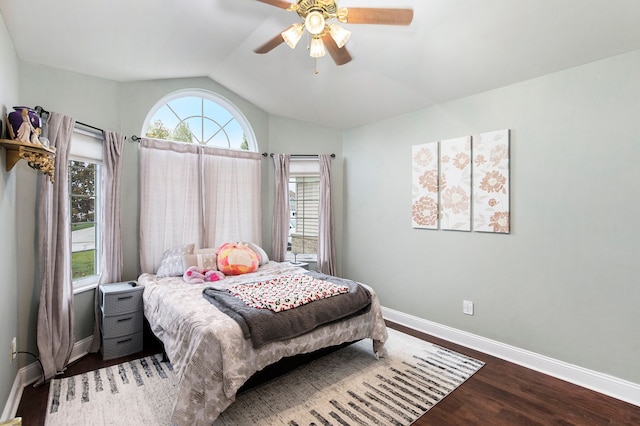 bedroom with hardwood / wood-style floors, ceiling fan, and vaulted ceiling