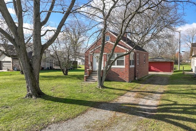 view of home's exterior featuring a yard, brick siding, and driveway