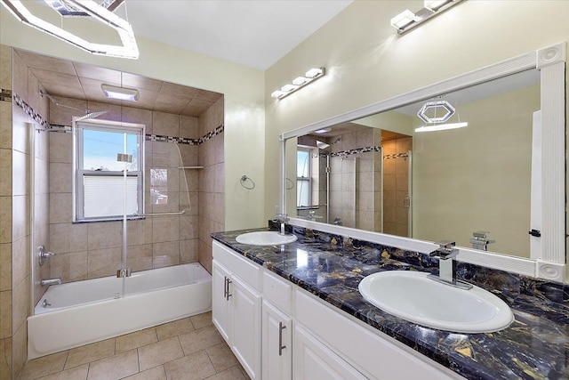 bathroom with tile patterned floors, vanity, and tiled shower / bath