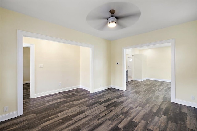 unfurnished room featuring ceiling fan and dark wood-type flooring