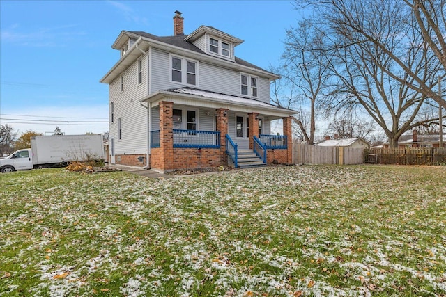 view of front of house featuring a porch and a front lawn