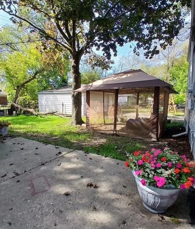 view of yard featuring a gazebo and a patio