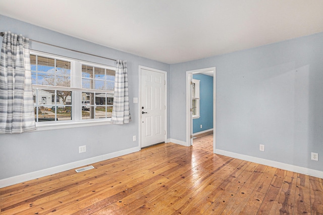 empty room featuring hardwood / wood-style flooring