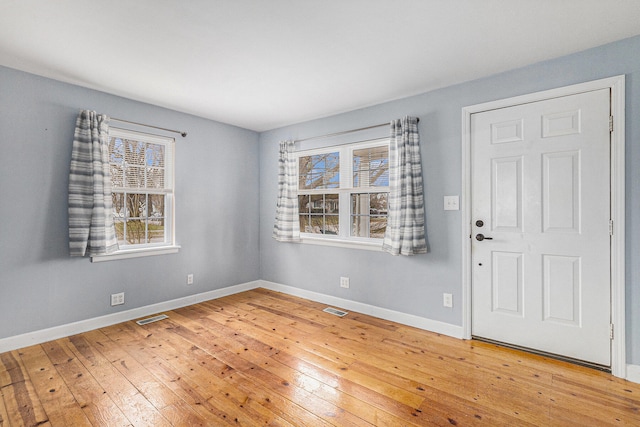 foyer entrance with hardwood / wood-style floors