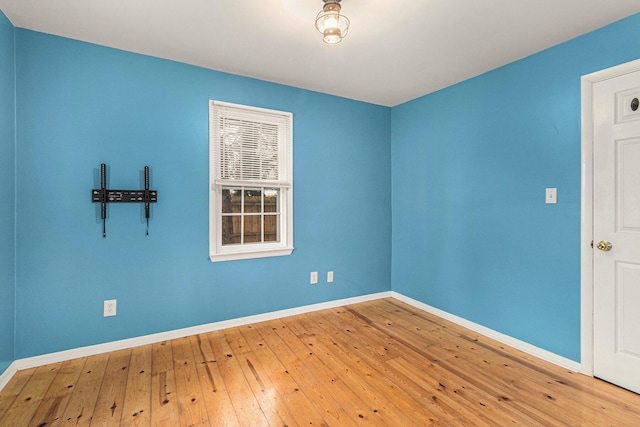 empty room with wood-type flooring