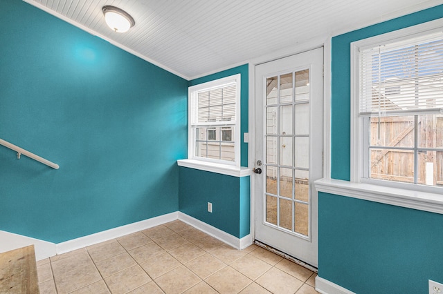 entryway featuring light tile patterned floors, wood ceiling, and ornamental molding