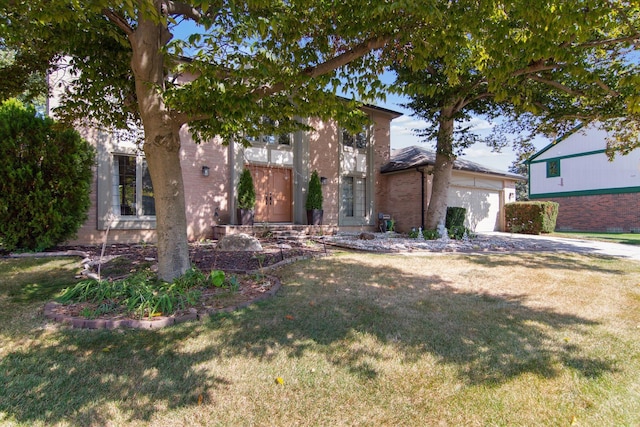 view of front facade with a front lawn and a garage