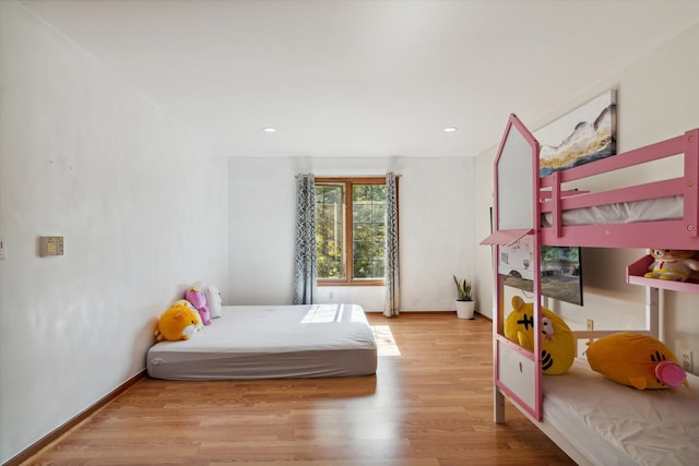 bedroom with light hardwood / wood-style flooring