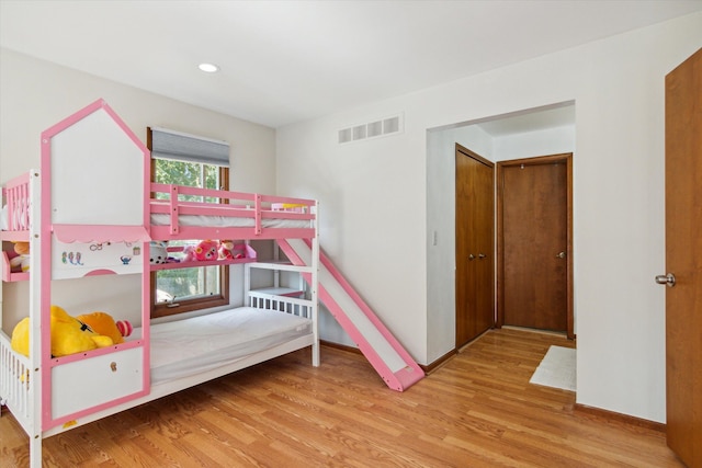 bedroom featuring hardwood / wood-style flooring and a closet