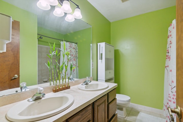 bathroom with tile patterned floors, a shower with curtain, vanity, and toilet