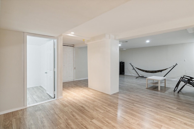 empty room with light hardwood / wood-style flooring