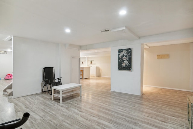 living room with light hardwood / wood-style floors