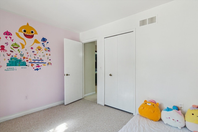 carpeted bedroom with a closet