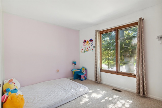 bedroom with light carpet