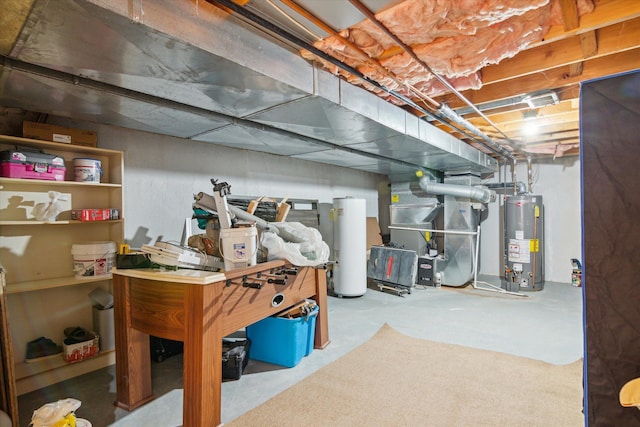 basement featuring heating unit and water heater