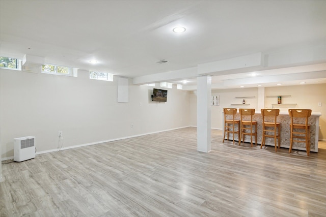 basement featuring light hardwood / wood-style floors