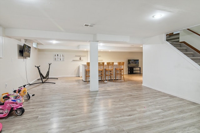 workout area featuring light wood-type flooring