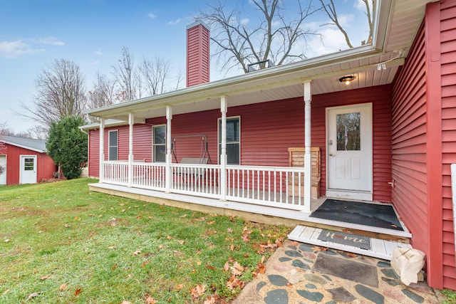 doorway to property with a yard