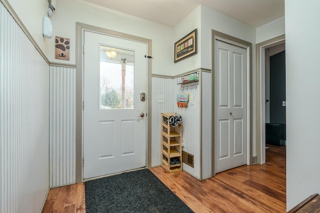 doorway to outside with hardwood / wood-style flooring