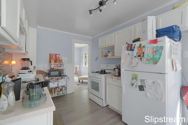 kitchen featuring white appliances, rail lighting, crown molding, light hardwood / wood-style flooring, and white cabinetry