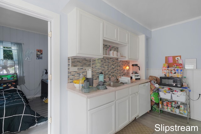 kitchen featuring dishwasher, white cabinetry, sink, and light hardwood / wood-style flooring