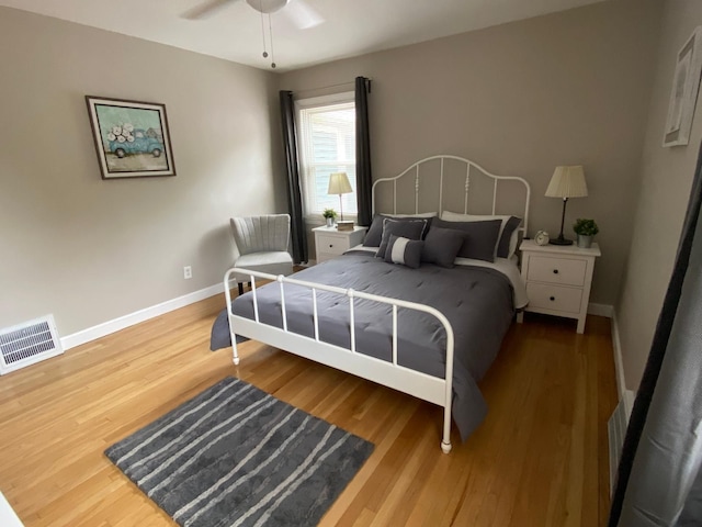 bedroom with hardwood / wood-style floors and ceiling fan