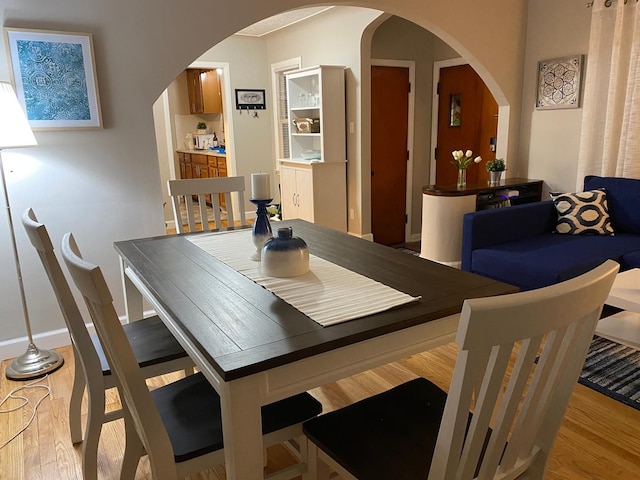 dining room with light wood-type flooring