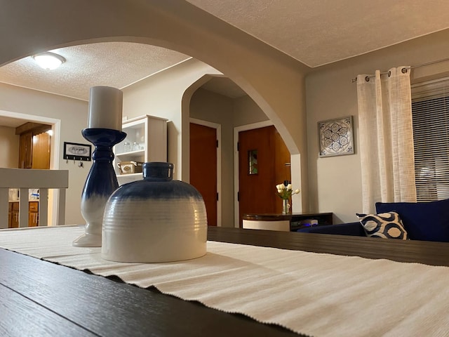 dining space with a textured ceiling