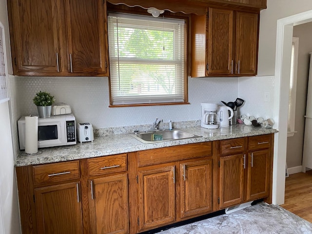 kitchen with sink and wood-type flooring