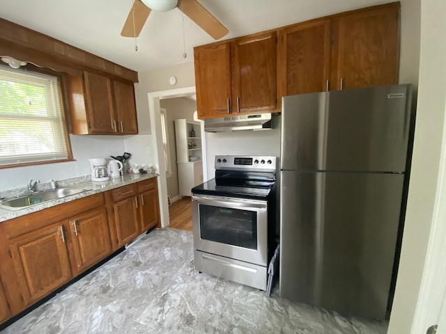 kitchen featuring ceiling fan, sink, and appliances with stainless steel finishes