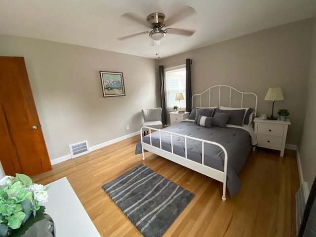 bedroom featuring hardwood / wood-style flooring and ceiling fan