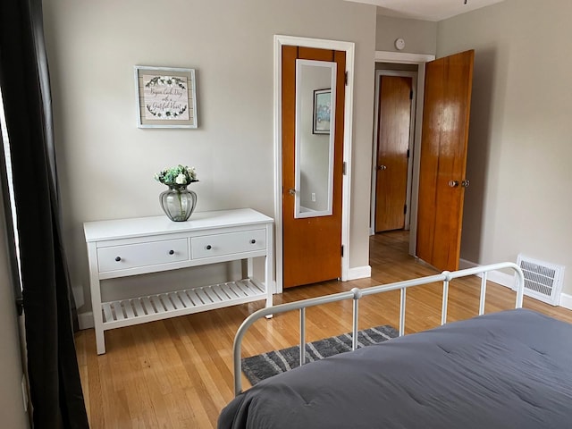 bedroom with light hardwood / wood-style flooring