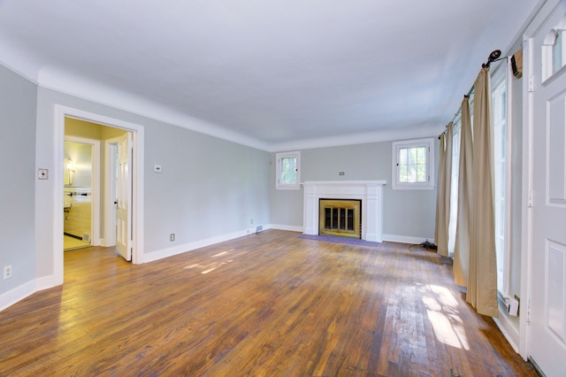 unfurnished living room featuring dark hardwood / wood-style floors