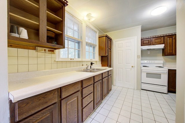 kitchen with light tile patterned floors, electric range, tasteful backsplash, and sink