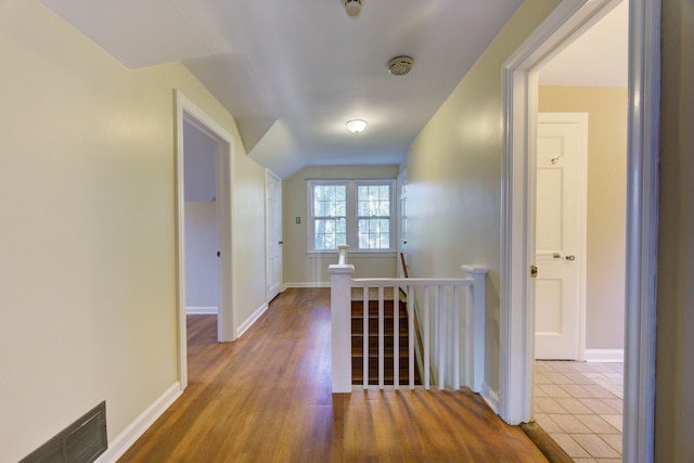 hall with hardwood / wood-style floors