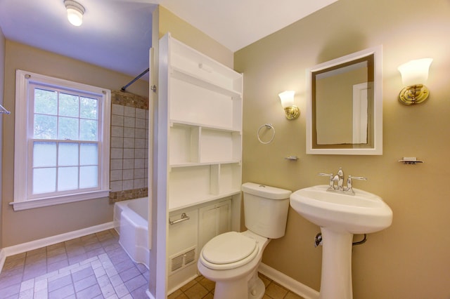 bathroom with sink, tile patterned flooring, and toilet