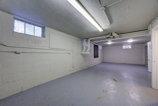 basement featuring a textured ceiling