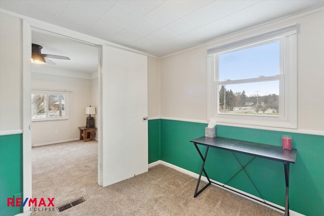 miscellaneous room with light carpet, ceiling fan, and crown molding