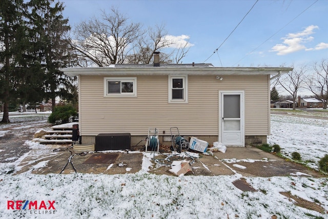 view of snow covered property