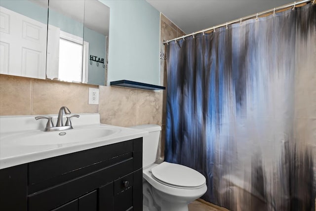 bathroom featuring vanity, toilet, tile walls, walk in shower, and tasteful backsplash