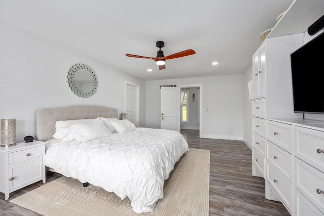 bedroom featuring dark hardwood / wood-style floors and ceiling fan