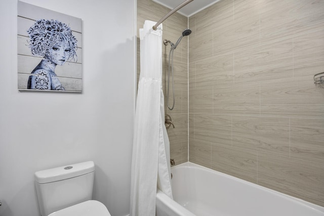 bathroom with shower / bathtub combination with curtain and toilet